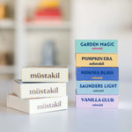Müstakil koku barları kutularıyla üst üste dizili: Garden Magic, Pumpkin Era, Mimosa Bliss, Saunders Light ve Vanilla Club